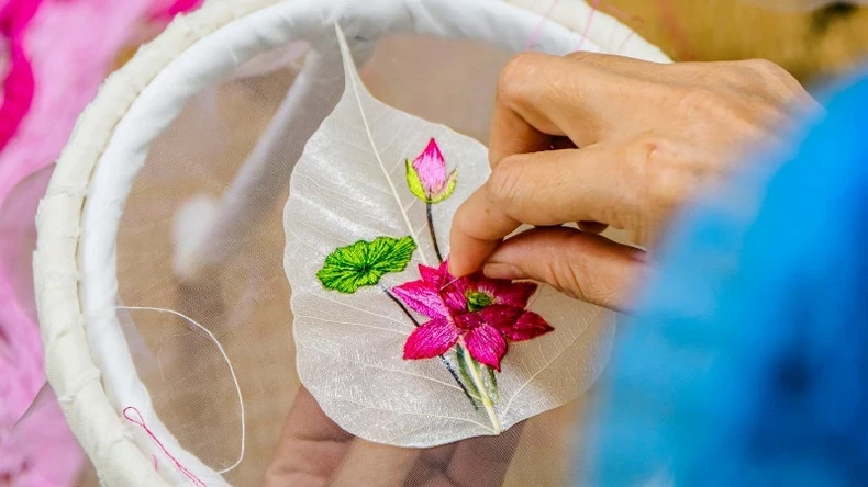 Embroidery on these delicate leaf skeletons requires technical precision and unwavering perseverance.
