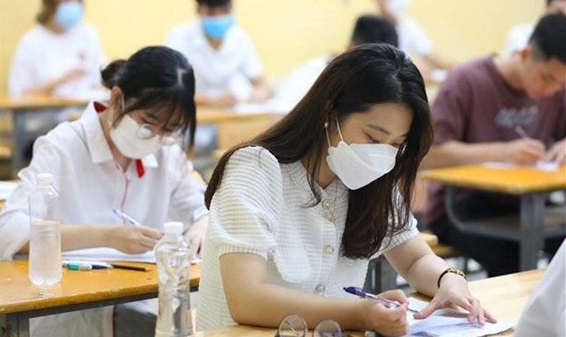 Examinees check personal information before taking the literature test at the Phan Dinh Phung High School in Hanoi's Ba Dinh district on July 7 morning.